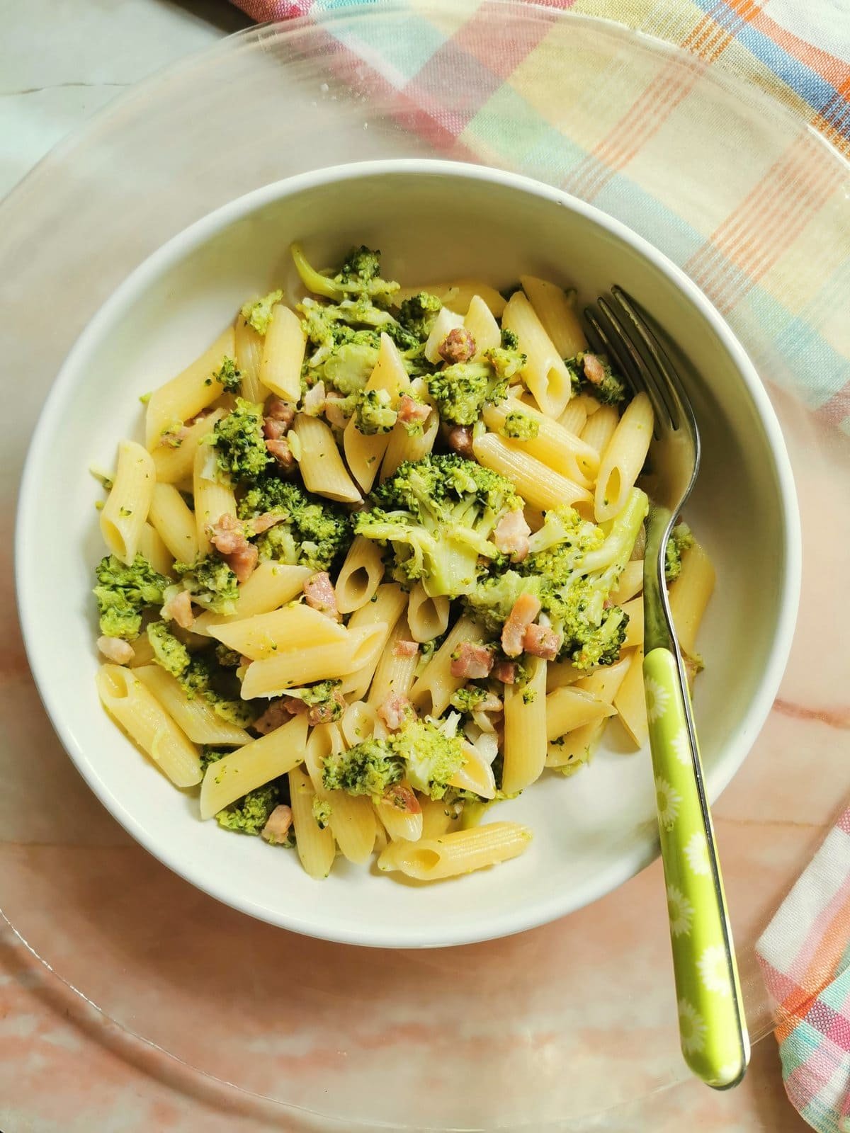 Penne pasta with broccoli and pancetta.
