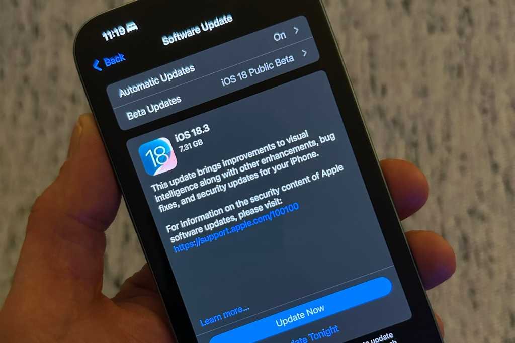 iOS 18.3 download screen on an iPhone 14 Pro