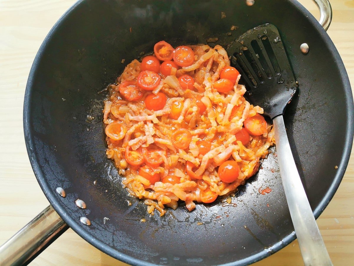 Ready shallots and guancial sauce in deep frying pan.