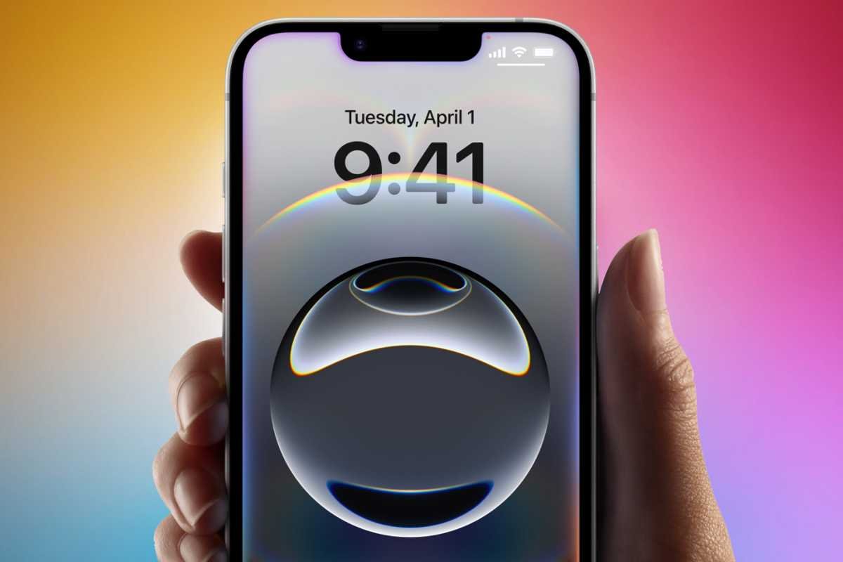 Hand that holds iPhone 16E with Siri enabled