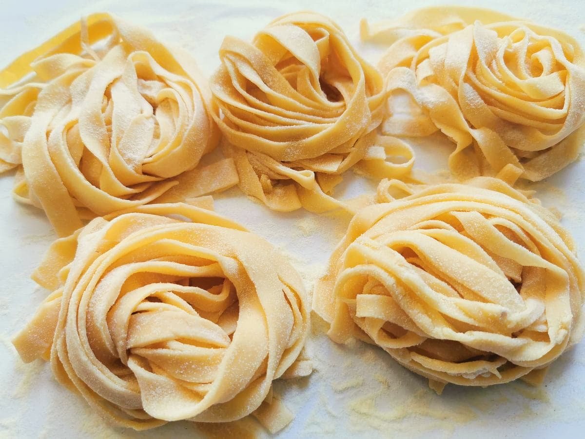 Nests of homemade tagliatelle pasta.