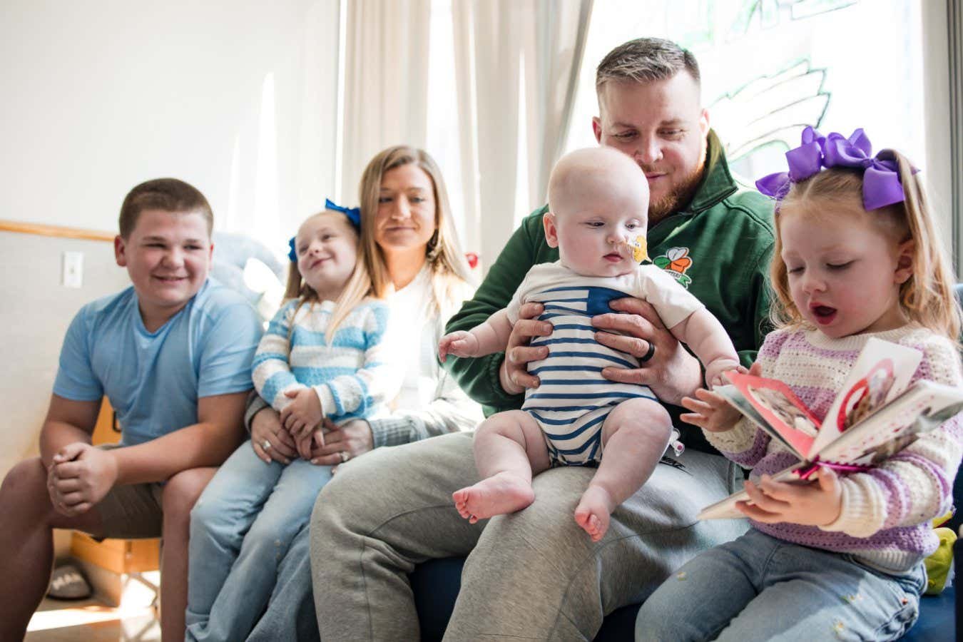 Kj with his family after treatment