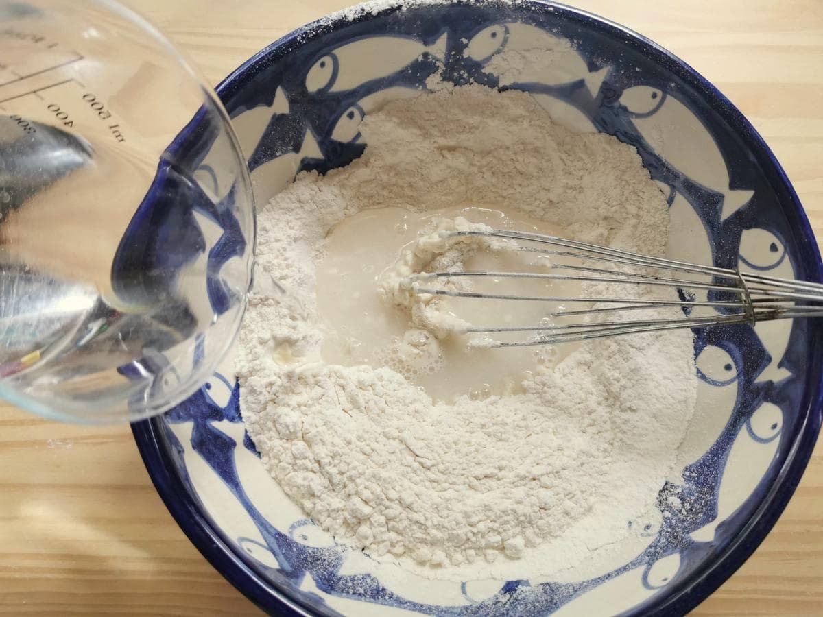 Step 1. Flour in large bowl of water added.