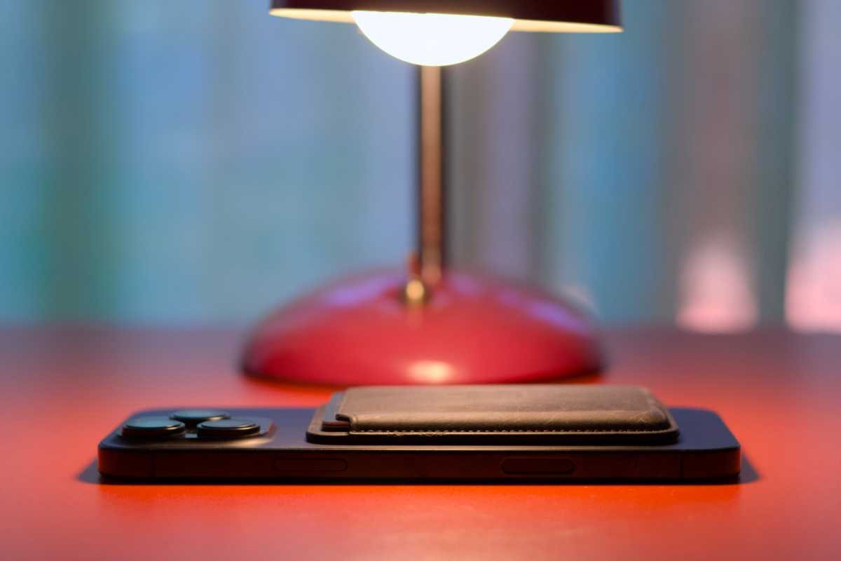 iPhone with Magsafe Wallet attached under a lamp