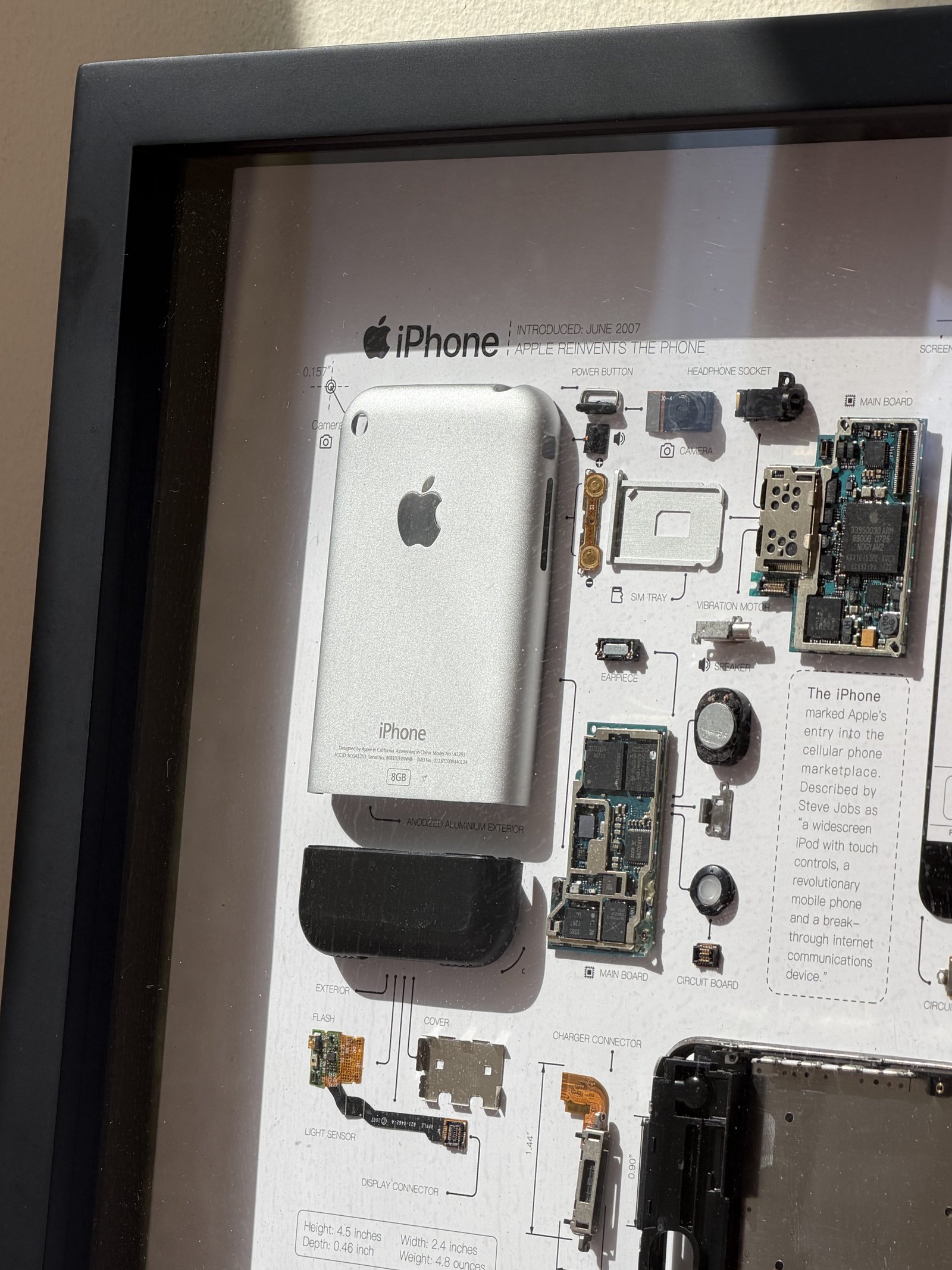 Image of the original iPhone in a frame with iPhone 17 Pro Max at 5x Tele